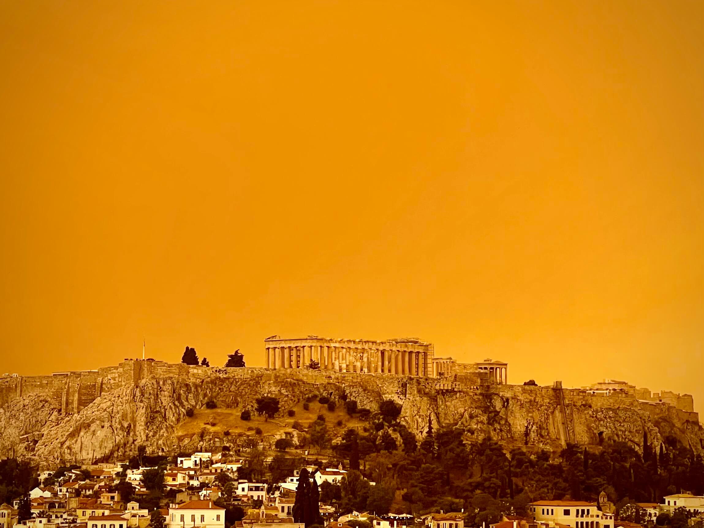 Spectacular Athens skyline coloured orange by Sahara sand