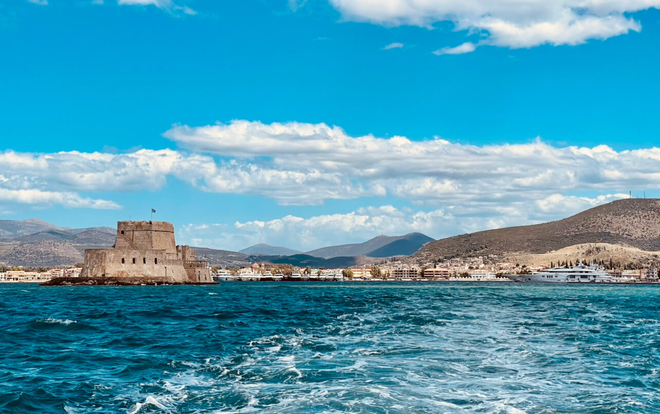 Nafplio town viewed from the tender with Bourtzi Castle on the left.
